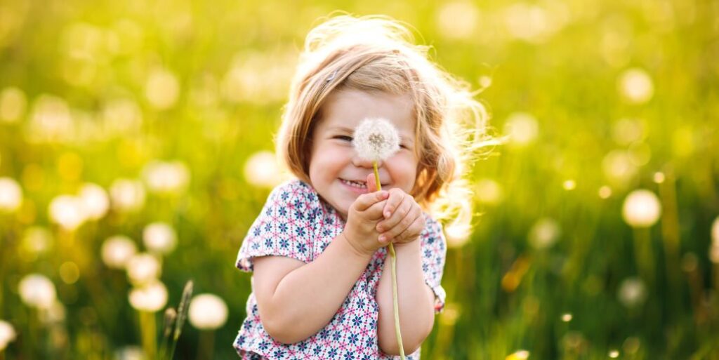 Young girl playing in field