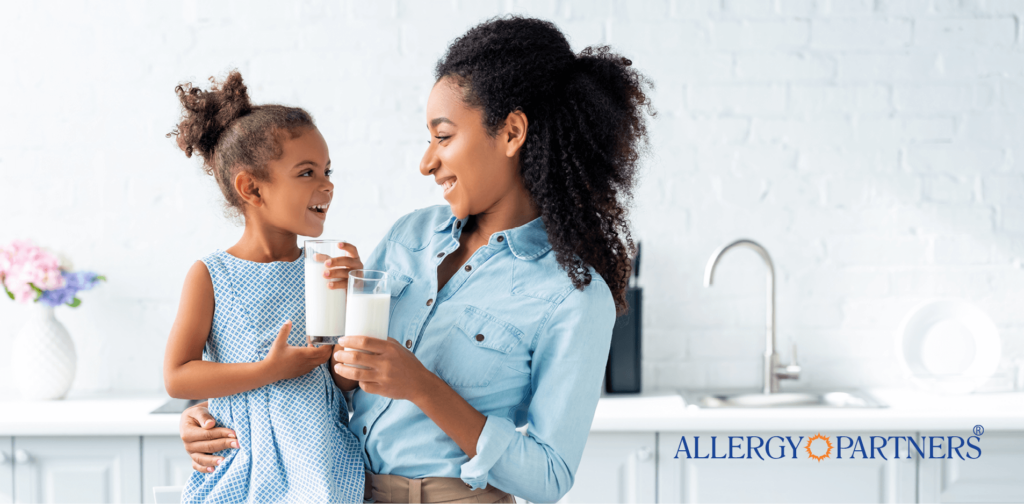 Mother and daughter drinking milk